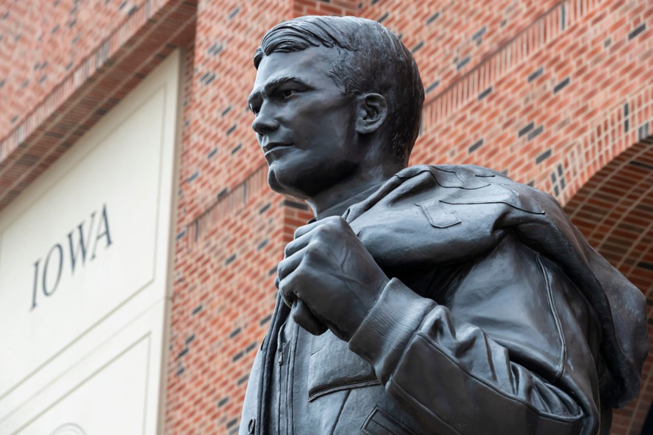 A statue of Nile Clarke Kinnick Jr., former student and a college football player at the University of Iowa, is seen on campus on July 21, 2019.