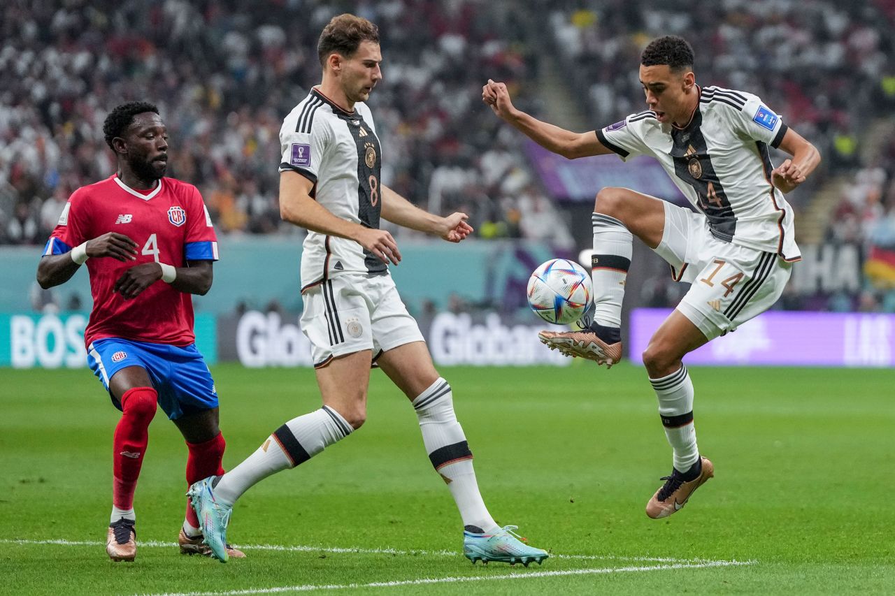 Germany's Jamal Musiala, right, controls the ball next to his teammate Leon Gorentzka during their match against Costa Rica.