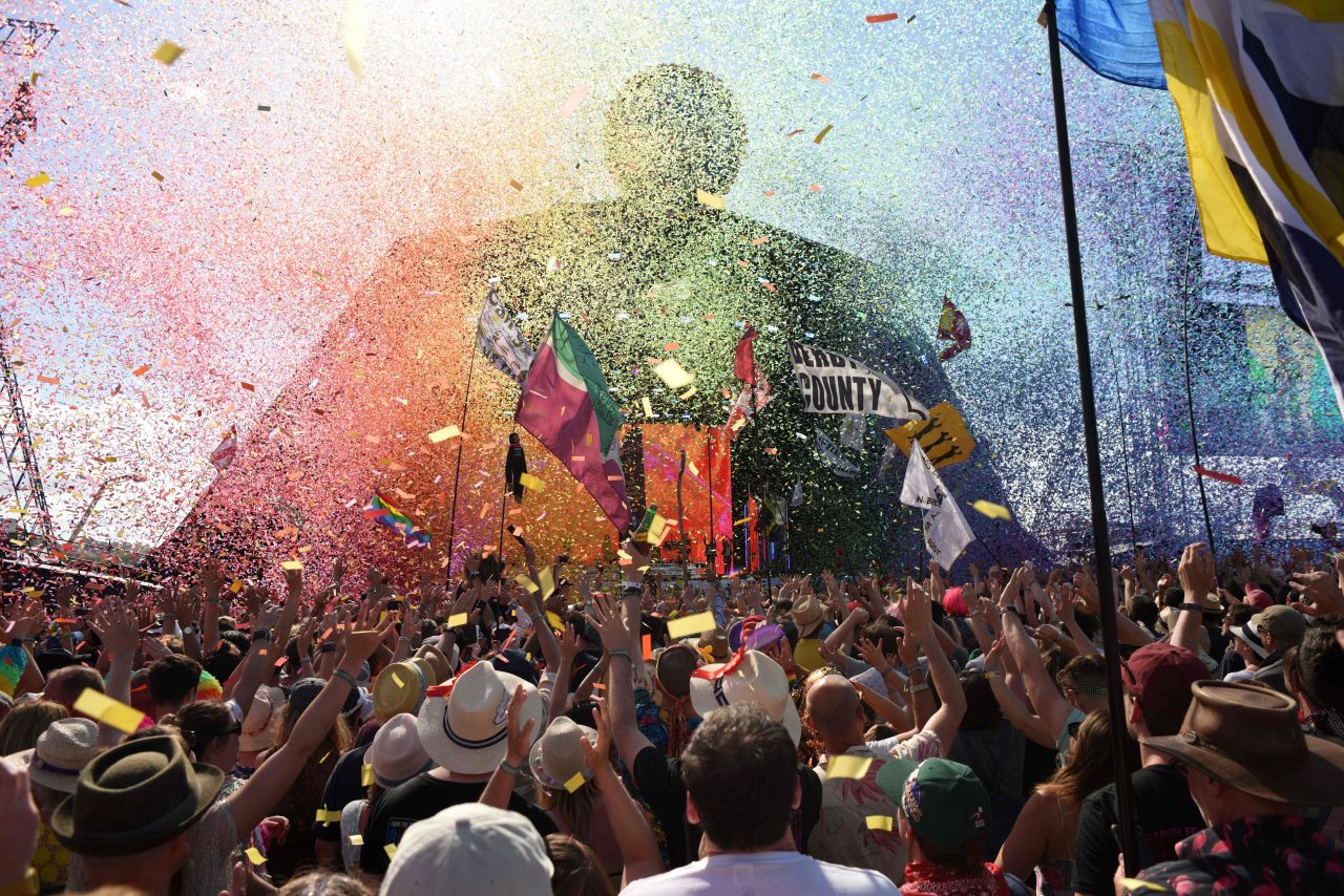 People cheer as singer Kylie prepares to perform at the Glastonbury Festival in Pilton, England, on June 30, 2019.
