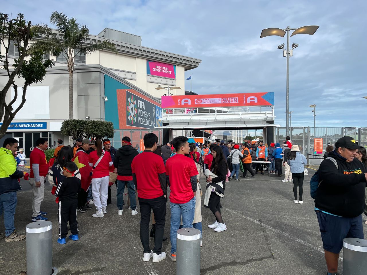 Fans line up to enter the stadium.