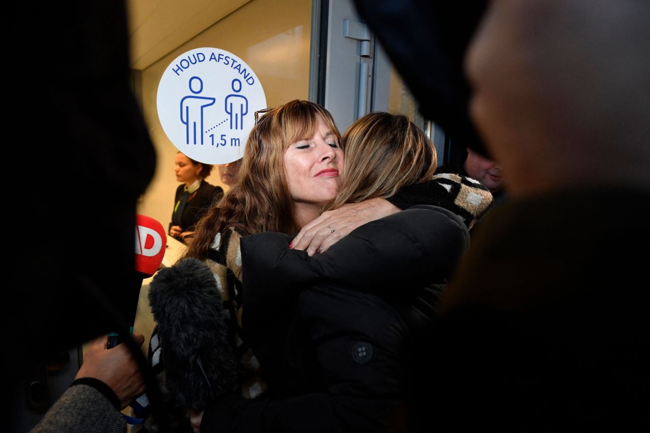 Victims' relatives embrace amid the trial of the MH17 downing case on November 17.