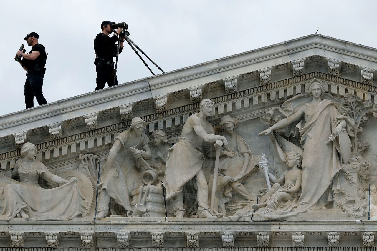 Members of the US Secret Service Counter-Sniper team set up watch from the roof of the House of Representatives on March 15, 2023, in Washington, DC. 