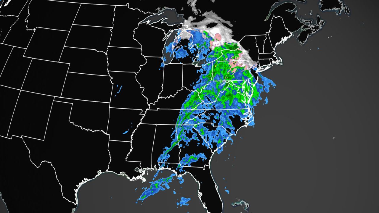 Weather radar shows a wide-reaching storm bringing rain (blue and green) and wintry mix (pink) to the eastern US on Tuesday afternoon.