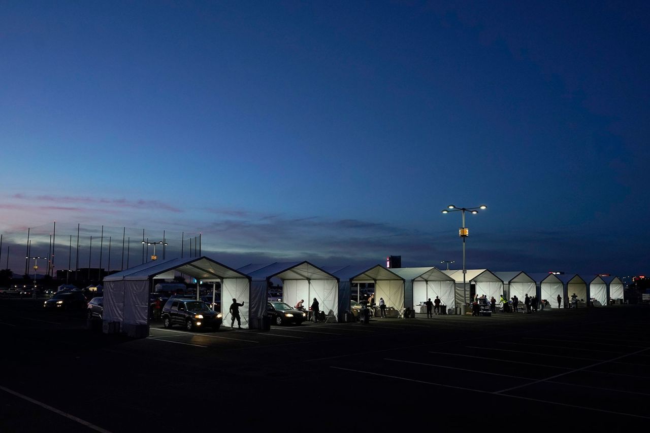 Motorists get vaccinated for Covid-19 at a drive-thru vaccination site in Glendale, Arizona, on January 12.