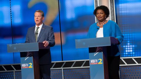 Georgia Gov. Brian Kemp and Democratic challenger Stacey Abrams debate each other in Atlanta on Sunday.