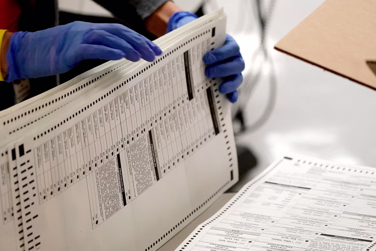 Maricopa County elections officials count ballots at the Maricopa County Recorder's Office in Phoenix, on November 4.