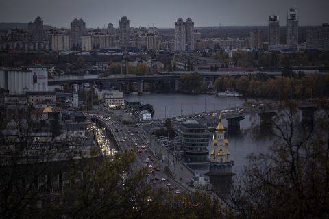 Traffic is seen by the Dnipro River at dusk in Kyiv, Ukraine on October 19. 