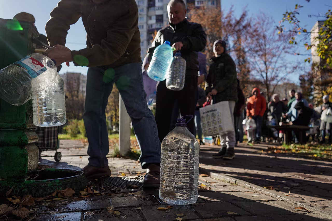 Local residents queue for water at a pump in Kyiv, Ukraine, on October 31