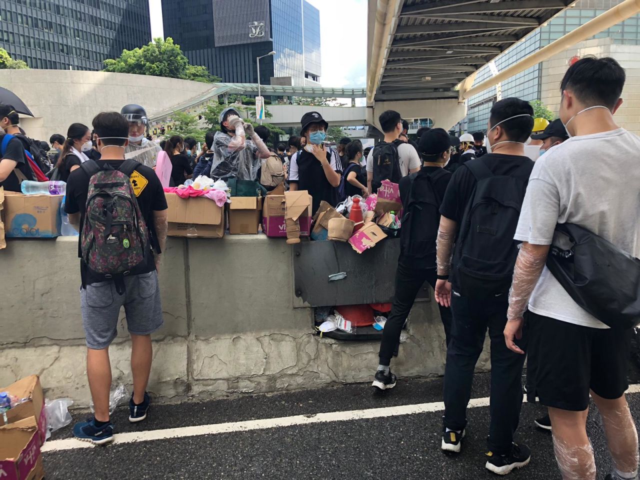 Protesters hand out cling film and water in Admiralty in preparation for a day of protests.