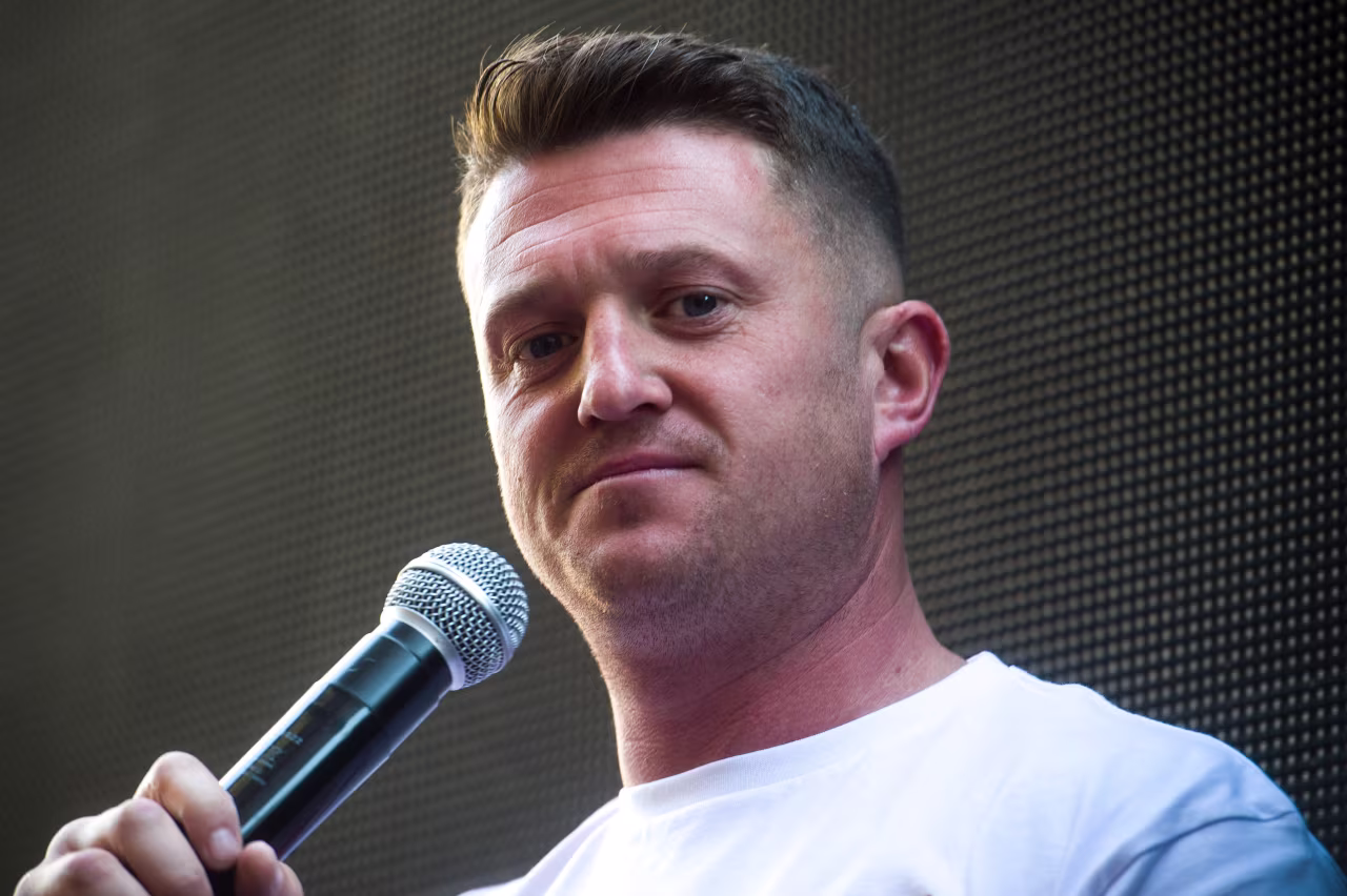 British far-right activist Tommy Robinson (real name Stephen Yaxley-Lennon) speaks to supporters outside the Old Bailey in London on May 14.