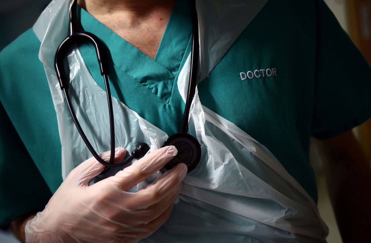 A junior doctor tends to a patient at the Royal Blackburn Teaching Hospital in Blackburn, England, on May 14.