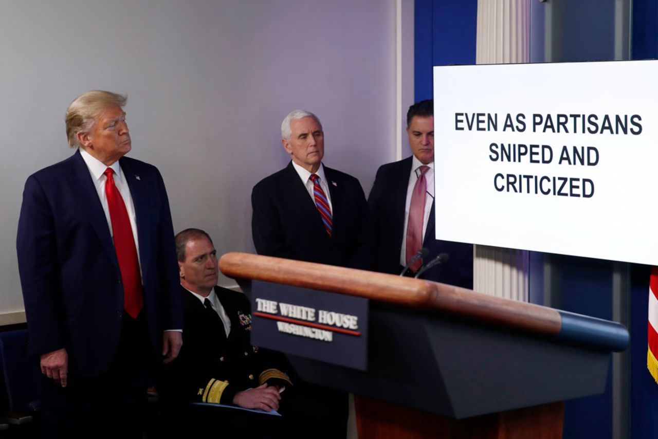 President Donald Trump watches as a White House produced video plays during a briefing about the coronavirus at the White House on Monday, April 13, in Washington.