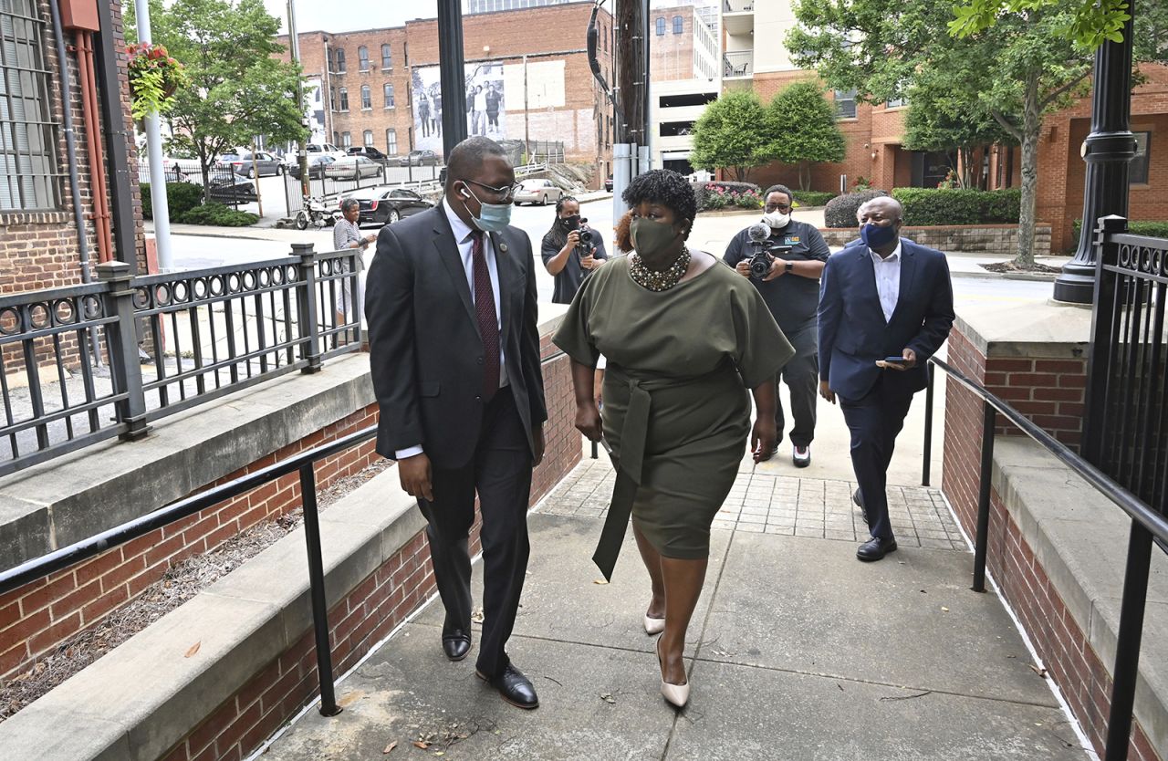 APS Executive Administrator Pierre Gaither (left) and new APS superintendent Lisa Herring talk before the Swearing-In Ceremony at Atlanta Public Schools Headquarters in Atlanta on Tuesday, June 30.