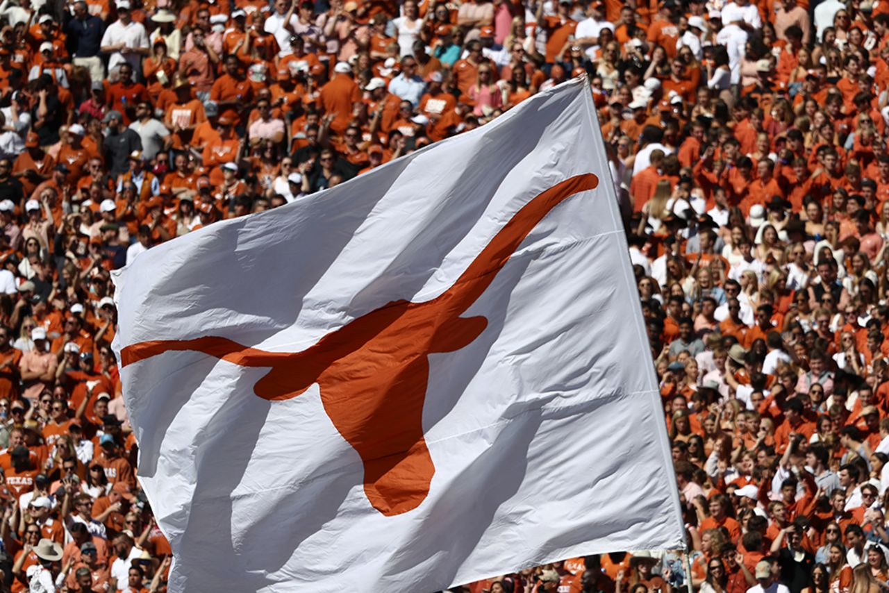 In this October 12, 2019 file photos, a Texas Longhorns flag waves during the 2019 AT&T Red River Showdown in Dallas, Texas.