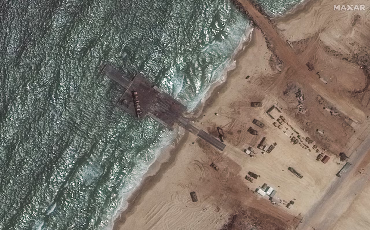 A satellite image shows a floating pier, which was constructed by the United States to help facilitate aid into Gaza, has been almost completely dismantled.
