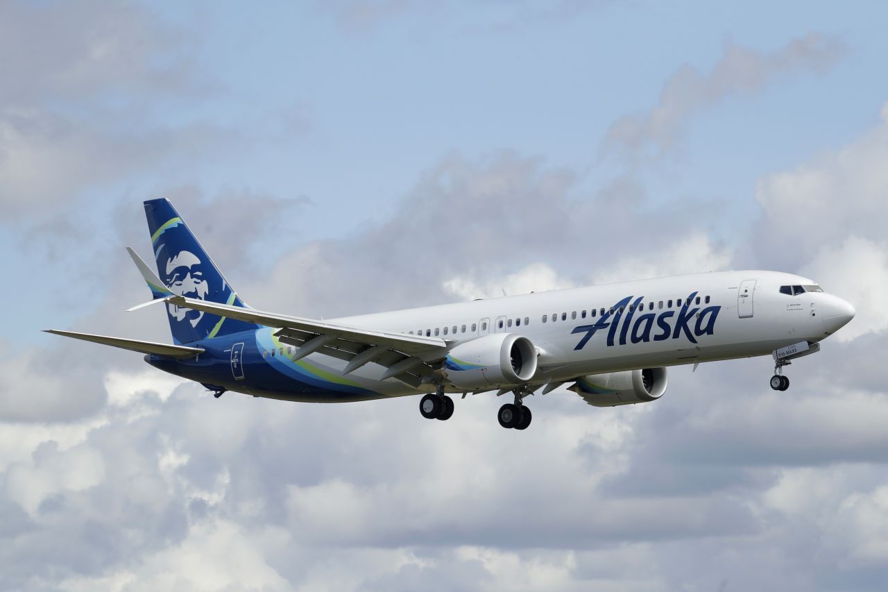 An Alaska Airlines Boeing 737-9 Max flies above Paine Field near Boeing's manufacturing facility in Everett, Washington, on March 23.