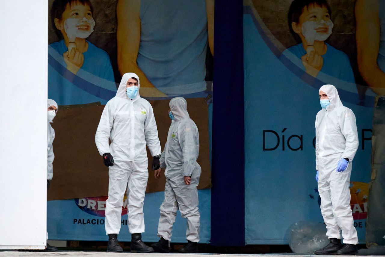 Members of Spain's Military Emergency Unit wait outside the Palacio de Hielo ice rink in Madrid, Spain, on March 24.