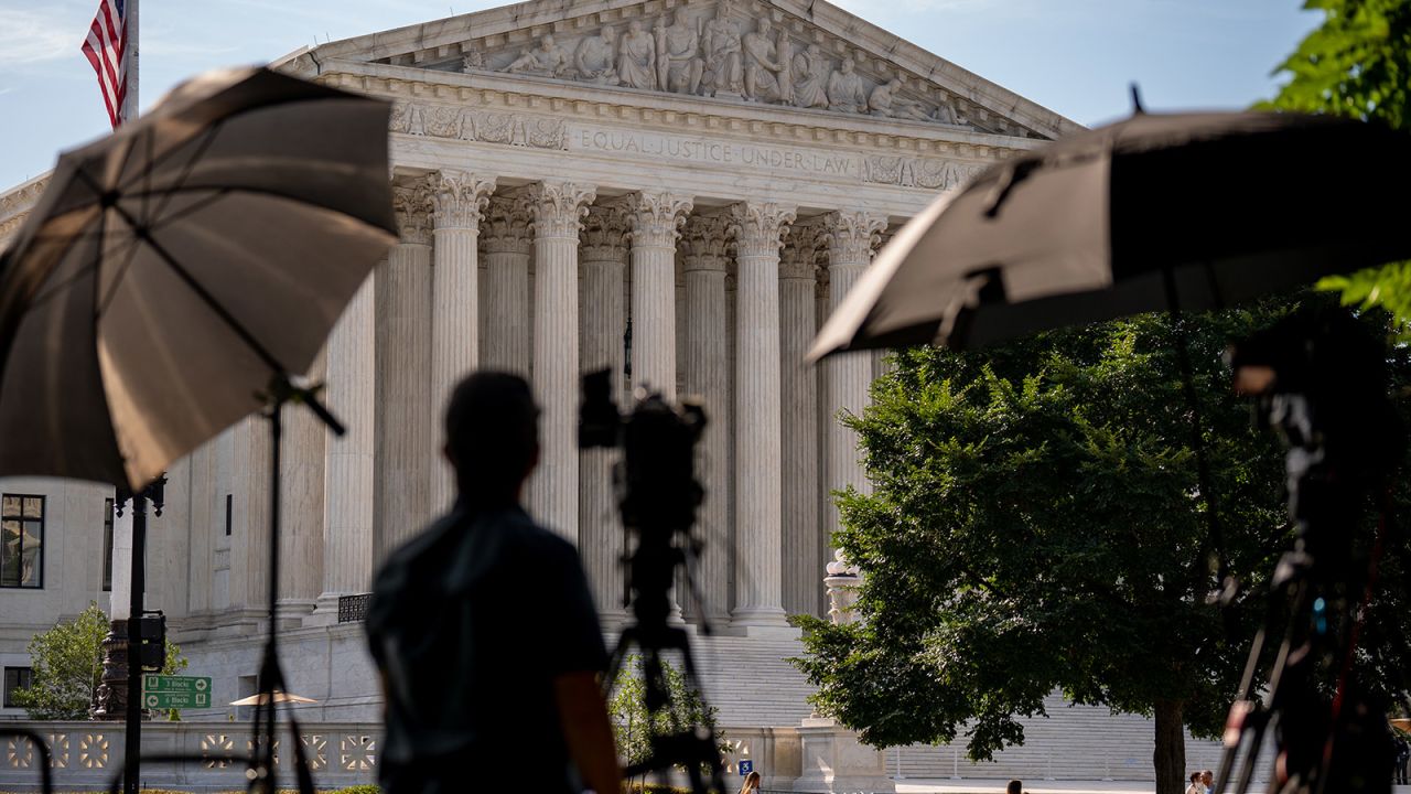 A member of the media sets up near the Supreme Court in Washington, DC on June 20.