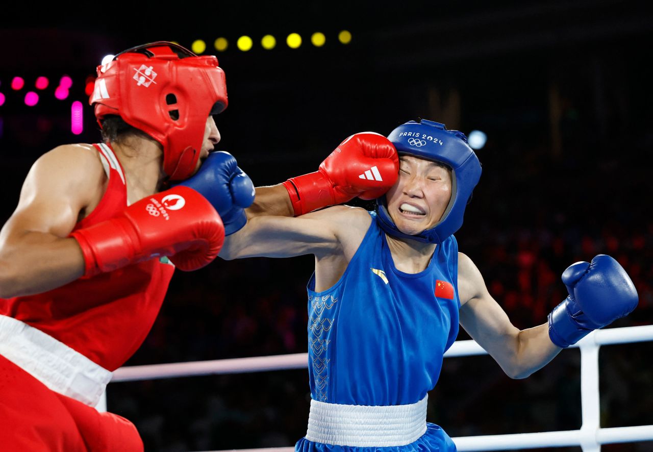 Algeria's Imane Khelif punches Yang Liu of China during the round 1 of the gold medal match Friday. 