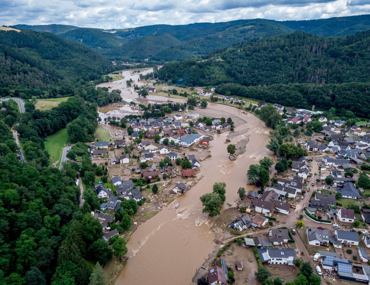 The Ahr river floats past destroyed houses in Insul, Germany, on Thursday.