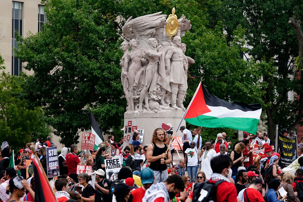 Demonstrators gather around the George Gordon Meade Memorial.