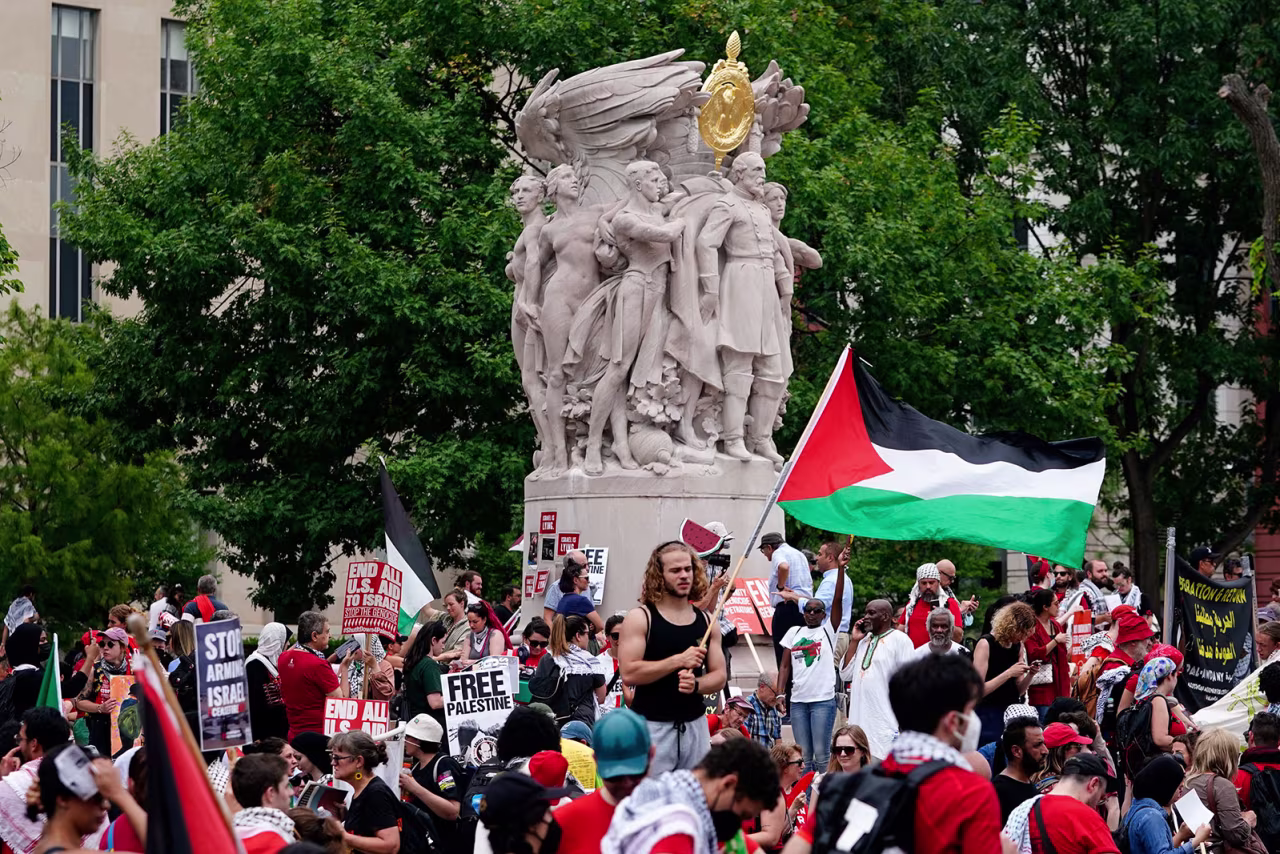 Demonstrators gather around the George Gordon Meade Memorial.