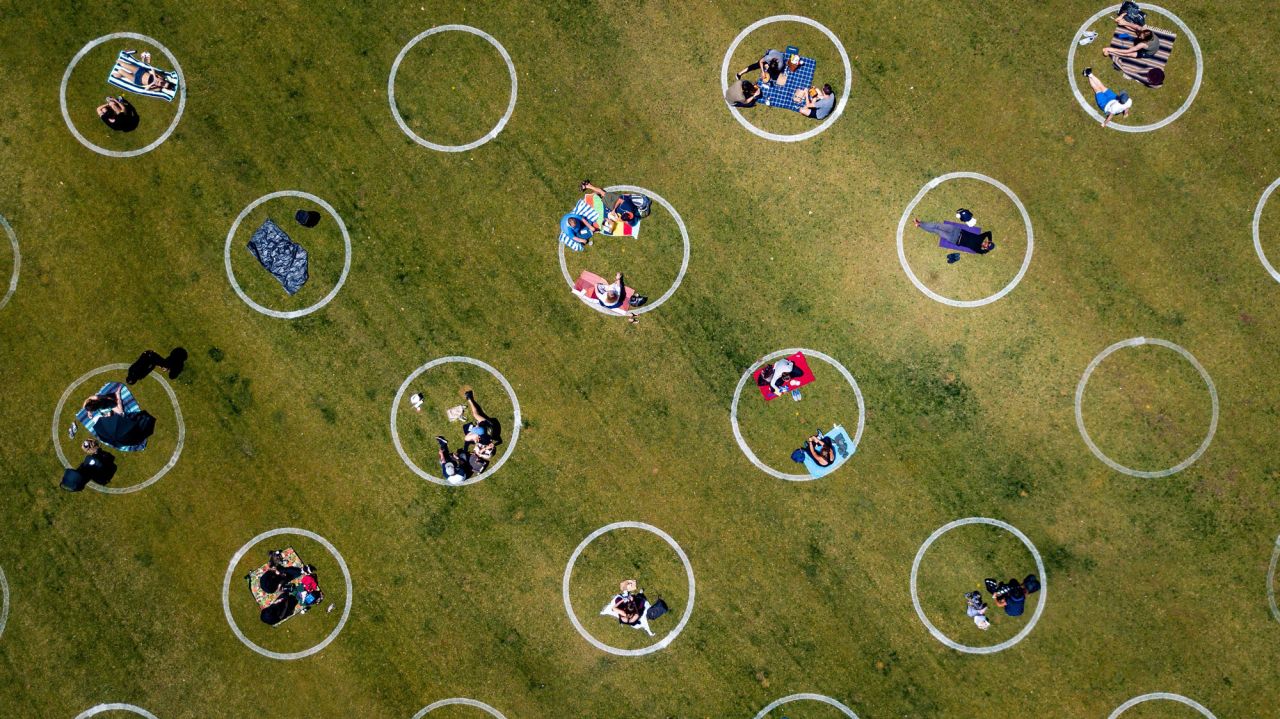 An aerial view shows painted circles in the grass to encourage people to social distance at Washington Square Park in San Francisco on May 22. 