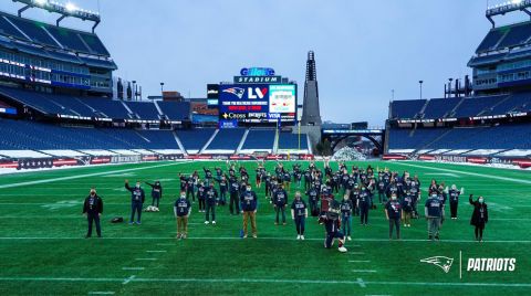 The Patriots posted this photo on Sunday morning of the 76 Super Bowl-bound vaccinated health care workers.