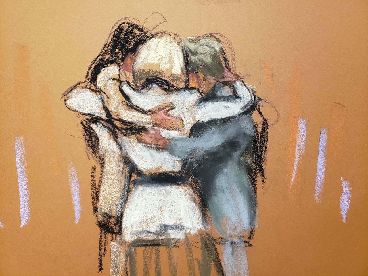 E. Jean Carroll hugs her team after the verdict was read Friday, in this courtroom sketch. 