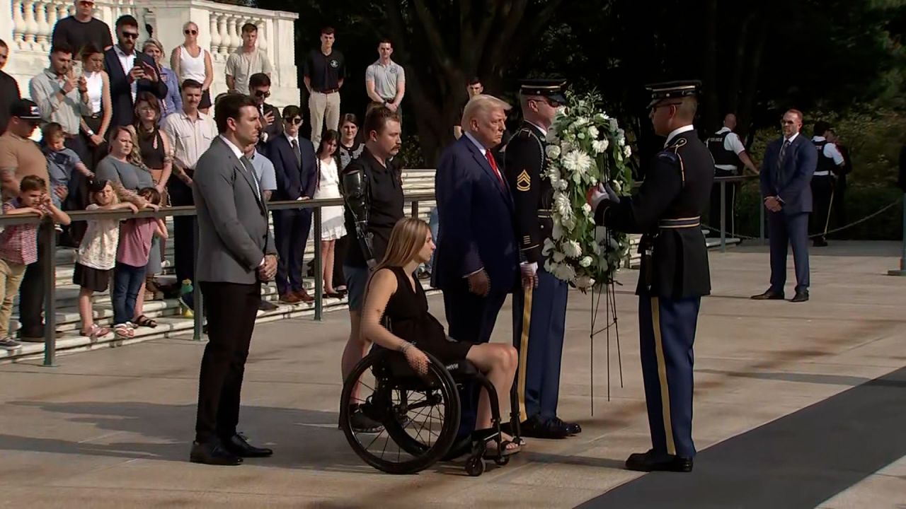 Donald Trump is seen participating in a wreath laying ceremony in Arlington on Monday.