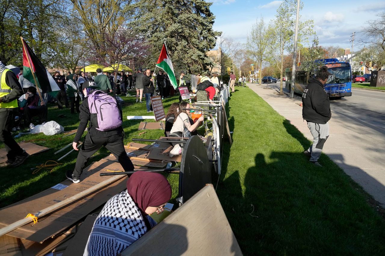 Demonstrators set up tables as protection against a possible police intervention as they protest over the Israel-Hamas war at the University of Wisconsin-Milwaukee on Monday. 