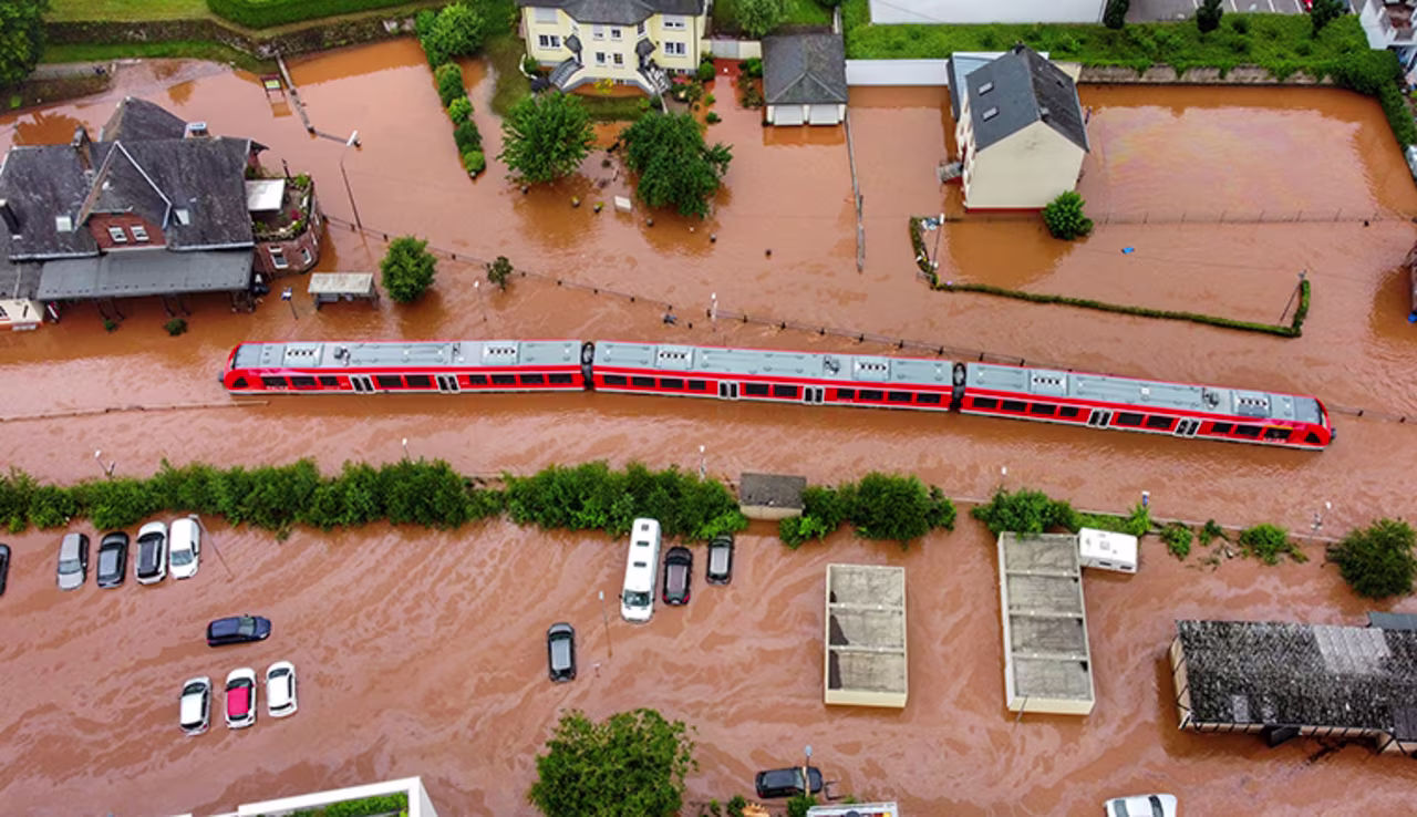 A regional train sits in the flood waters at the local station in Kordel, Germany, Thursday July 15, after it was flooded by the high waters of the Kyll river. 