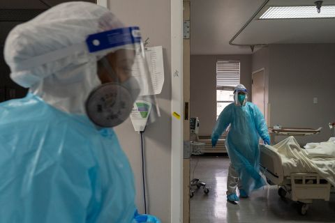 Medical staff members work in the Covid-19 intensive care unit at the United Memorial Medical Center in Houston, Texas, on December 29, 2020. 