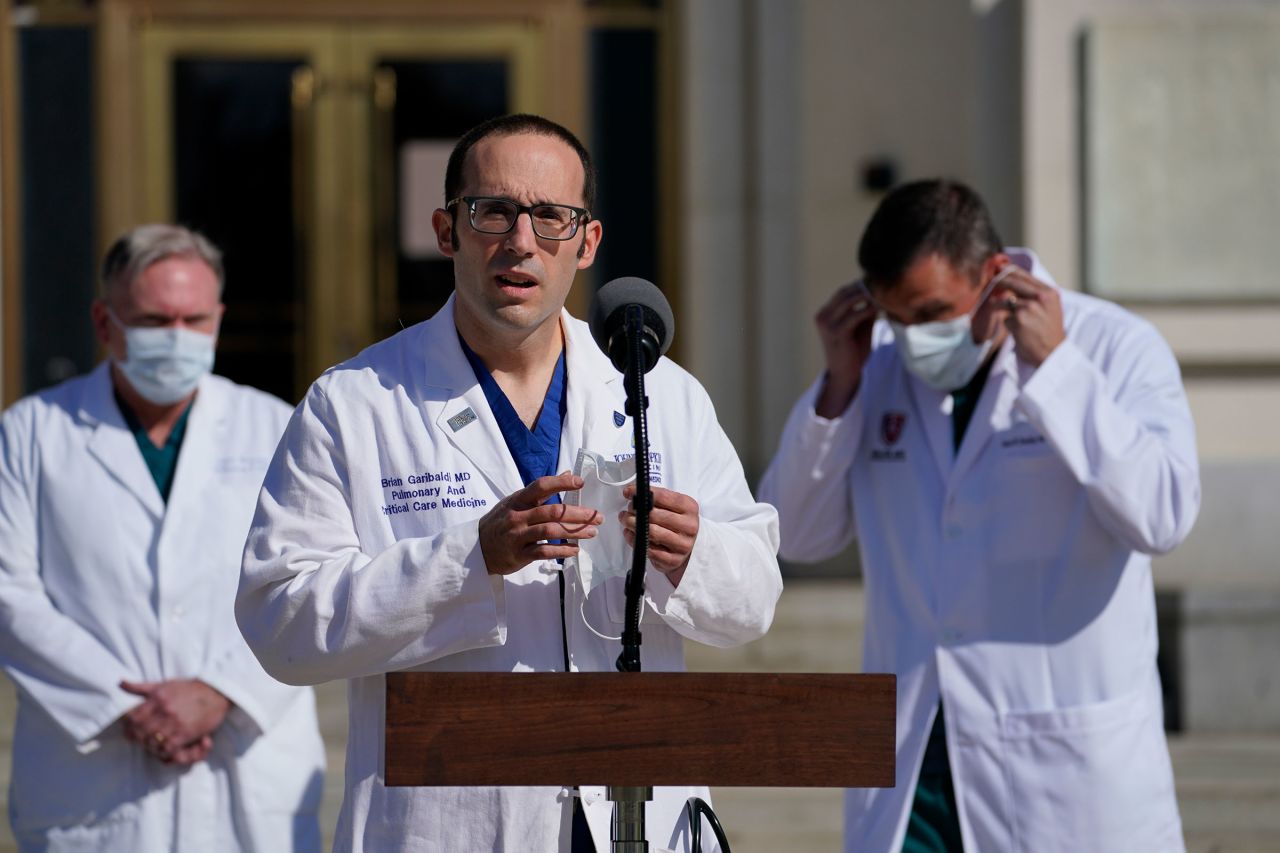 Dr. Brian Garibaldi, talks with reporters at Walter Reed National Military Medical Center on October 5 in Bethesda, Maryland