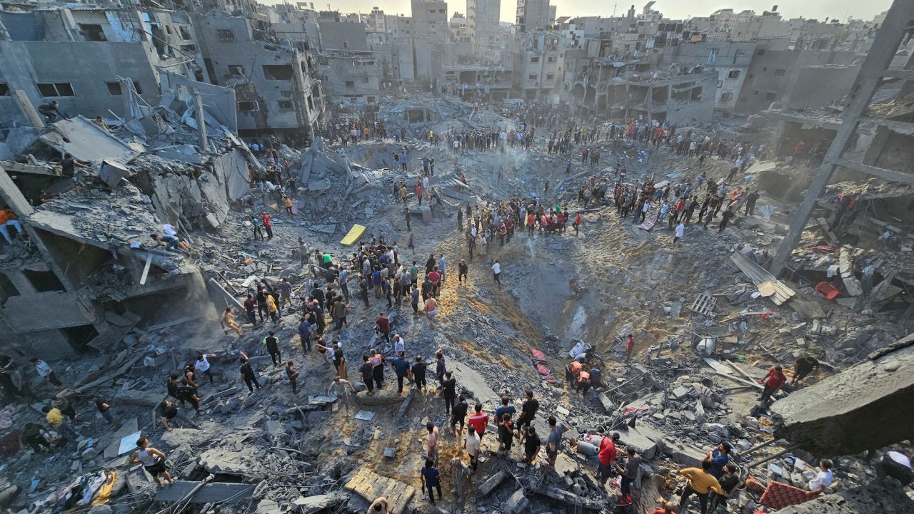 Palestinians search for casualties at the site of a strike in Jabalya Refugee Camp in Gaza on Tuesday.