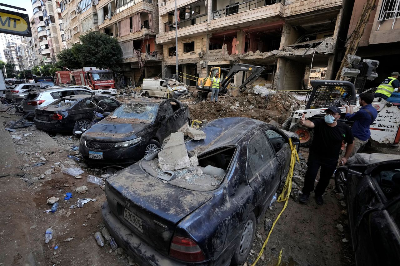 Damaged cars are seen at the site of Friday's Israeli strike in Beirut on September 21. 