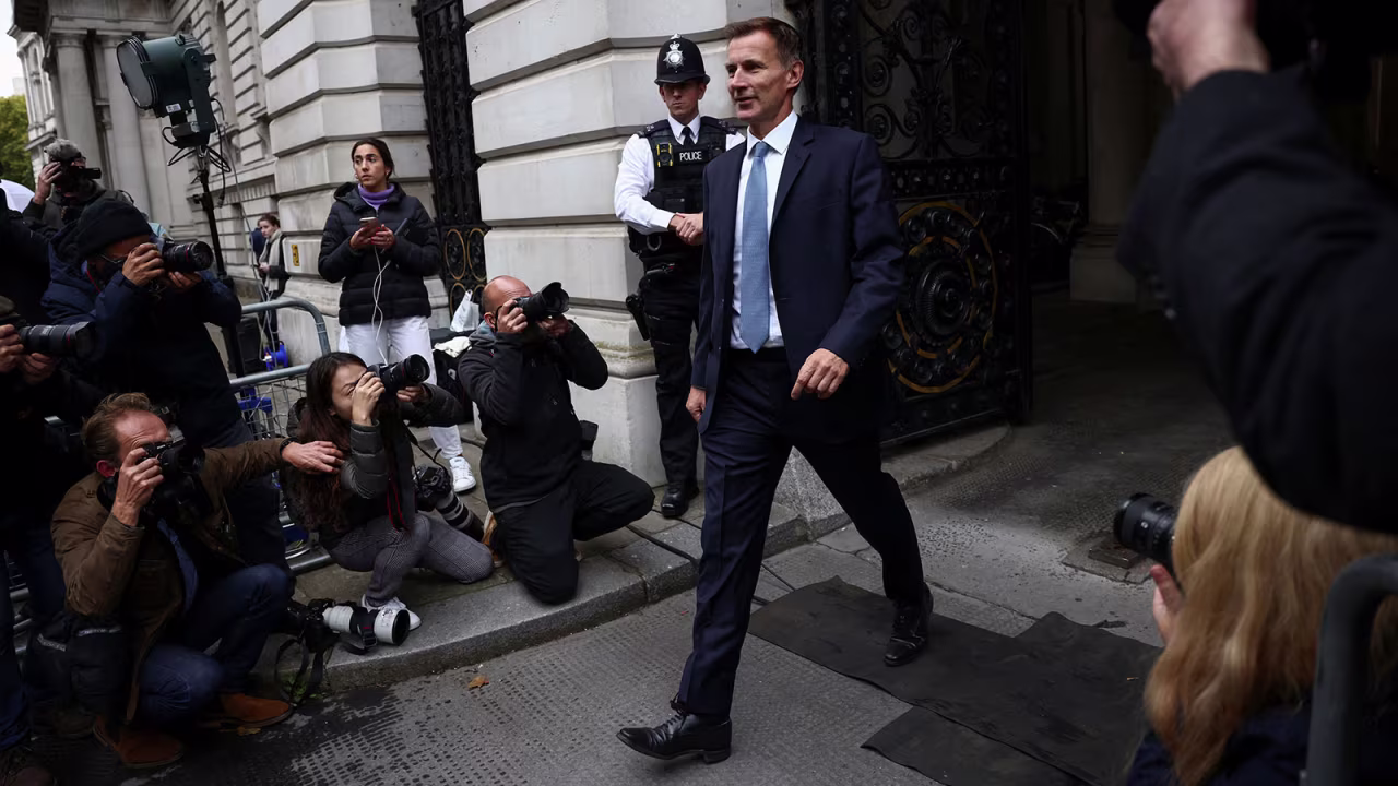 Newly appointed UK finance minister Jeremy Hunt arrives at Downing Street in London on October 14.