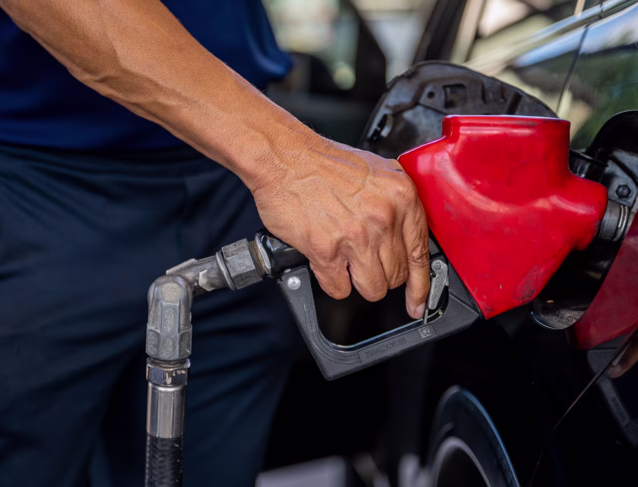 A customer pumps gas at an Exxon gas station on July 29, 2022 in Houston. 