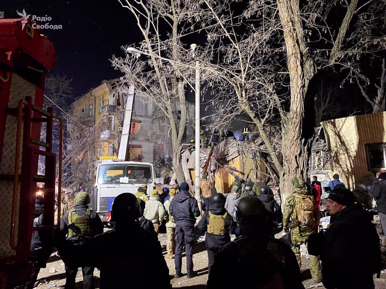 People work at a site of a residential building destroyed by a Russian missile strike February 1 in Kramatorsk.