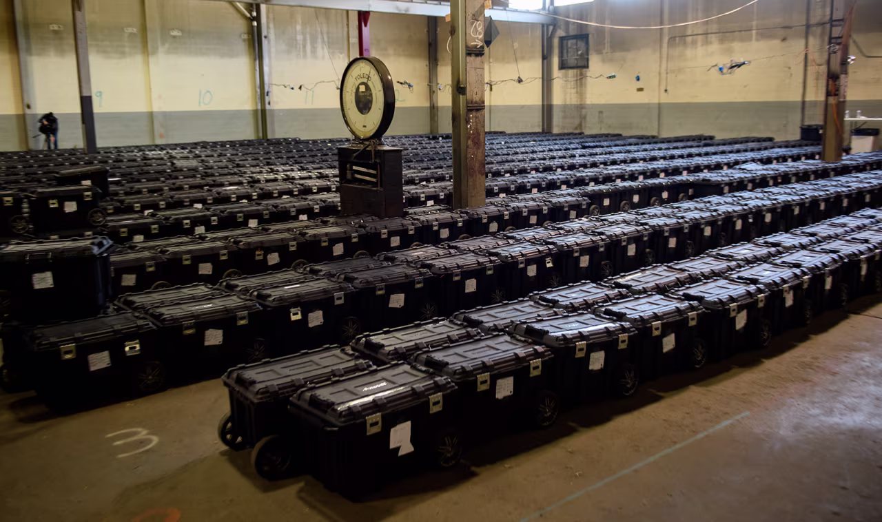Election precinct suitcases containing ballots, election materials and keys to voting machines are held under guard by the Allegheny County Police at the Allegheny County elections warehouse in Pittsburgh, Pennsylvania, on November 4.