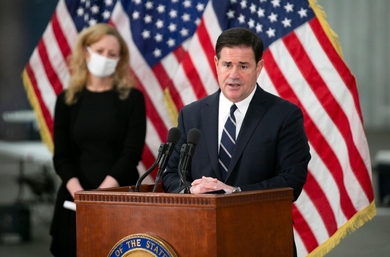 Arizona Governor Doug Ducey speaks during a press conference at the Arizona State Fairgrounds in Phoenix on December 16, 2020. 