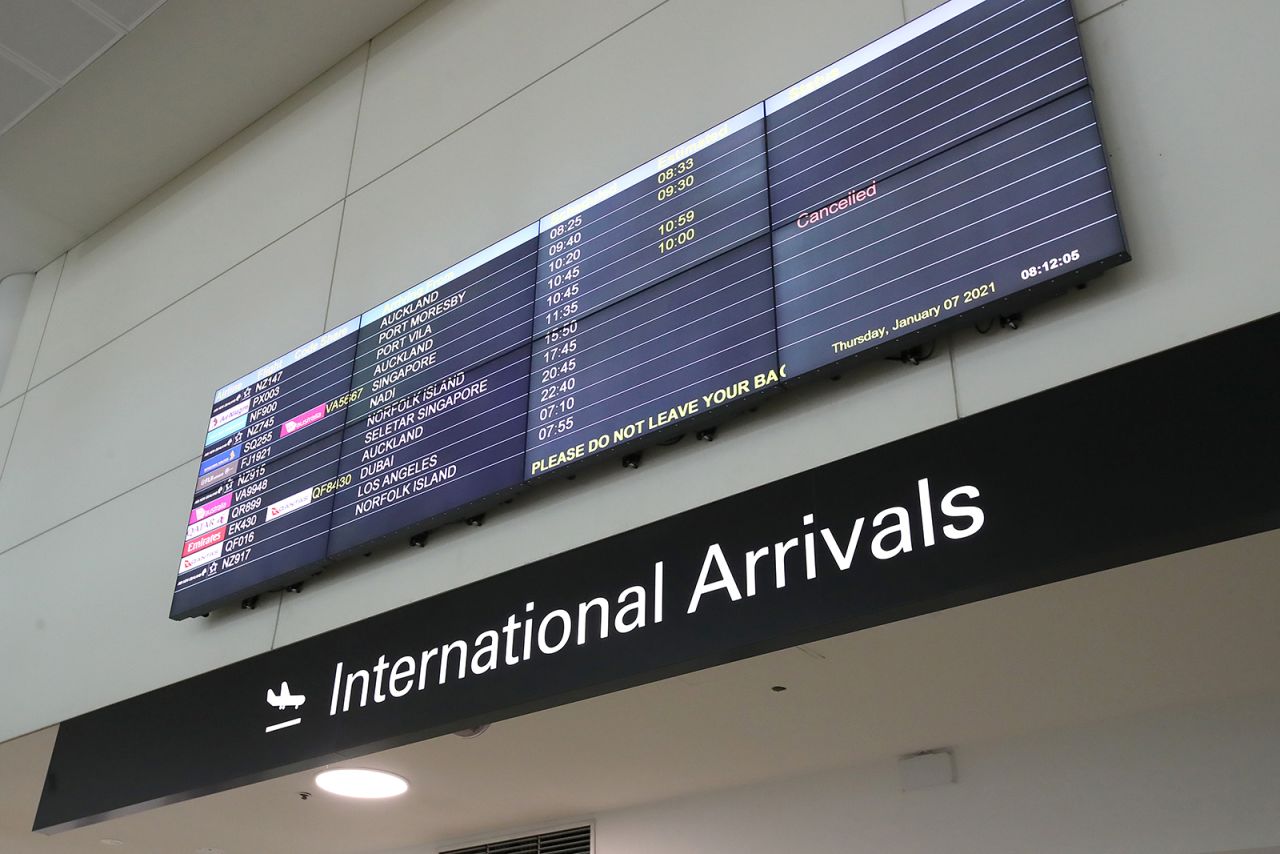 A digital screen displays flight arrival times at Brisbane Airport on January 7, in Brisbane, Australia.