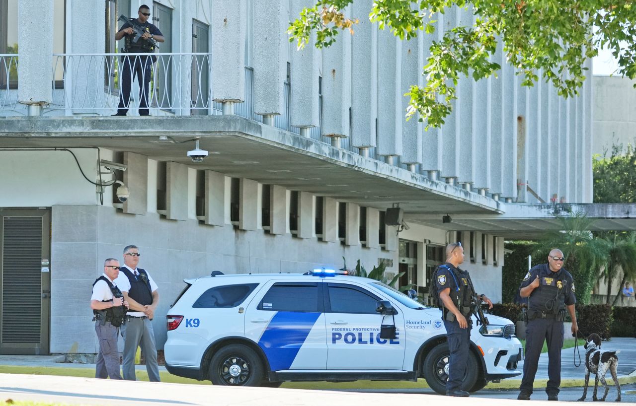 Law enforcement officers patrol outside the Paul G. Rogers Federal Building and US Courthouse, where Ryan Wesley Routh is expected to attend a hearing Monday in West Palm Beach, Florida.