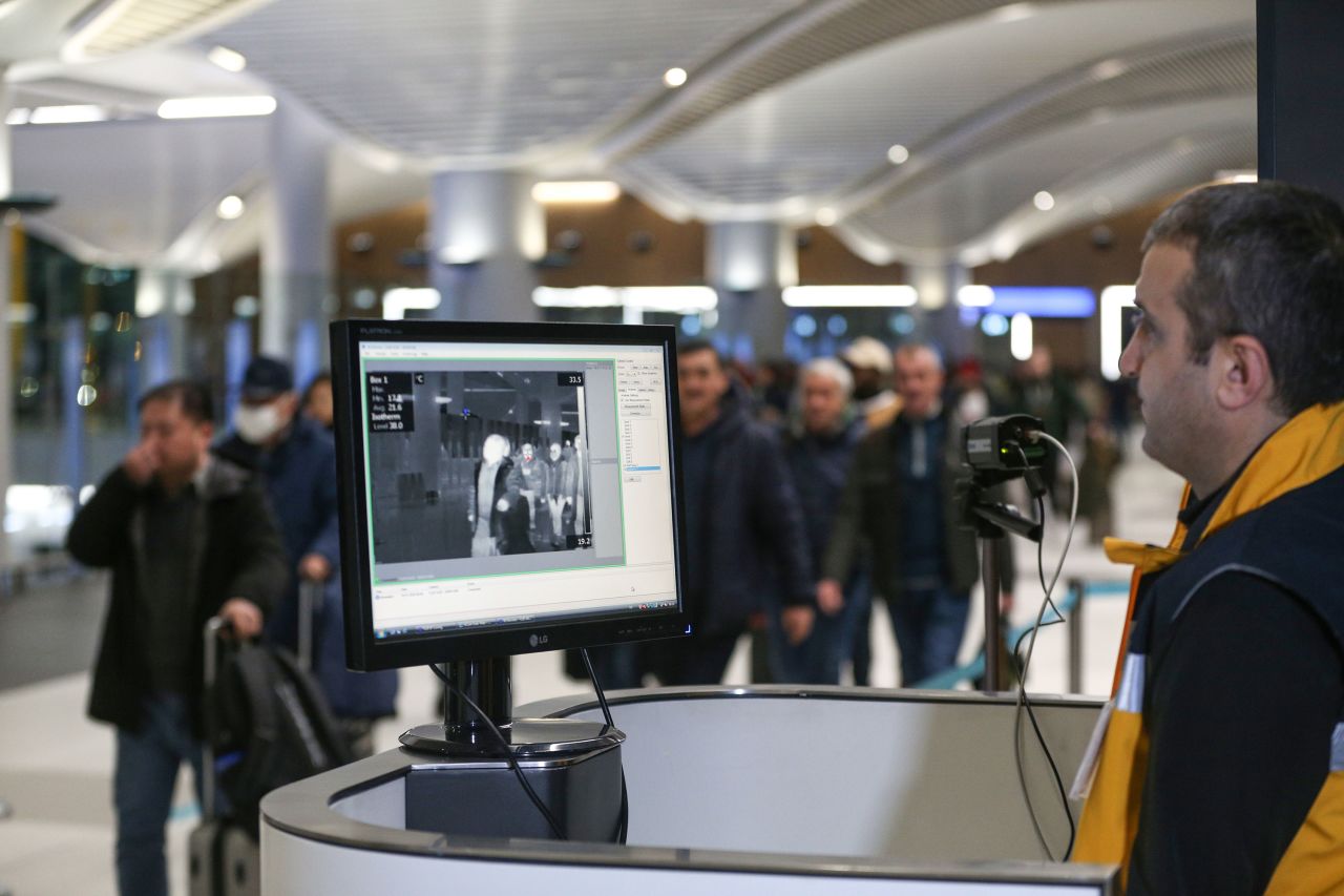 Passengers walk through a thermal scanner upon their arrival at Istanbul Airport, Turkey on January 24.