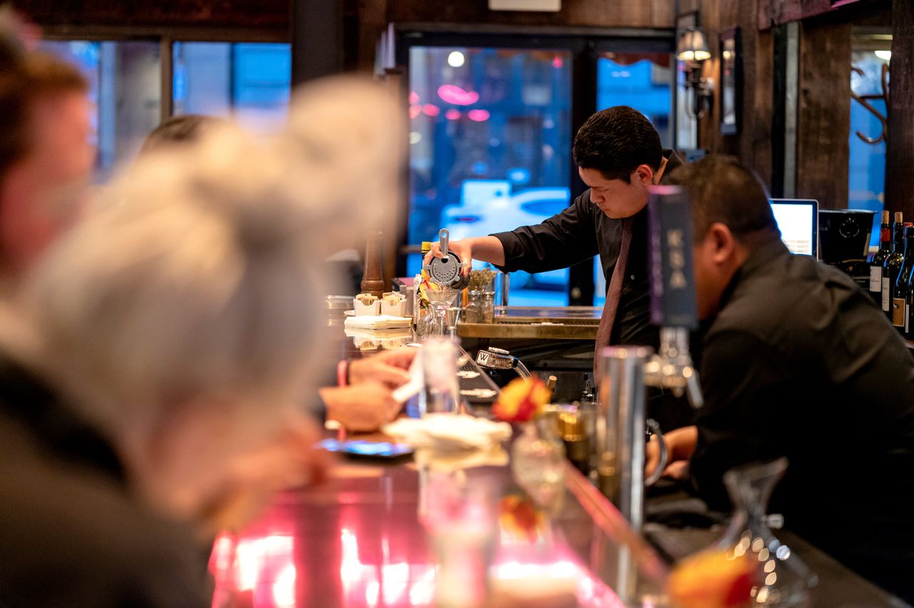 A bartender prepares a drink in Le Central restaurant in San Francisco, California, on May 7.