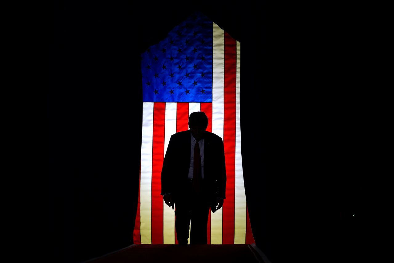 Former President Donald Trump steps on stage to at a campaign event in Manchester on Saturday.