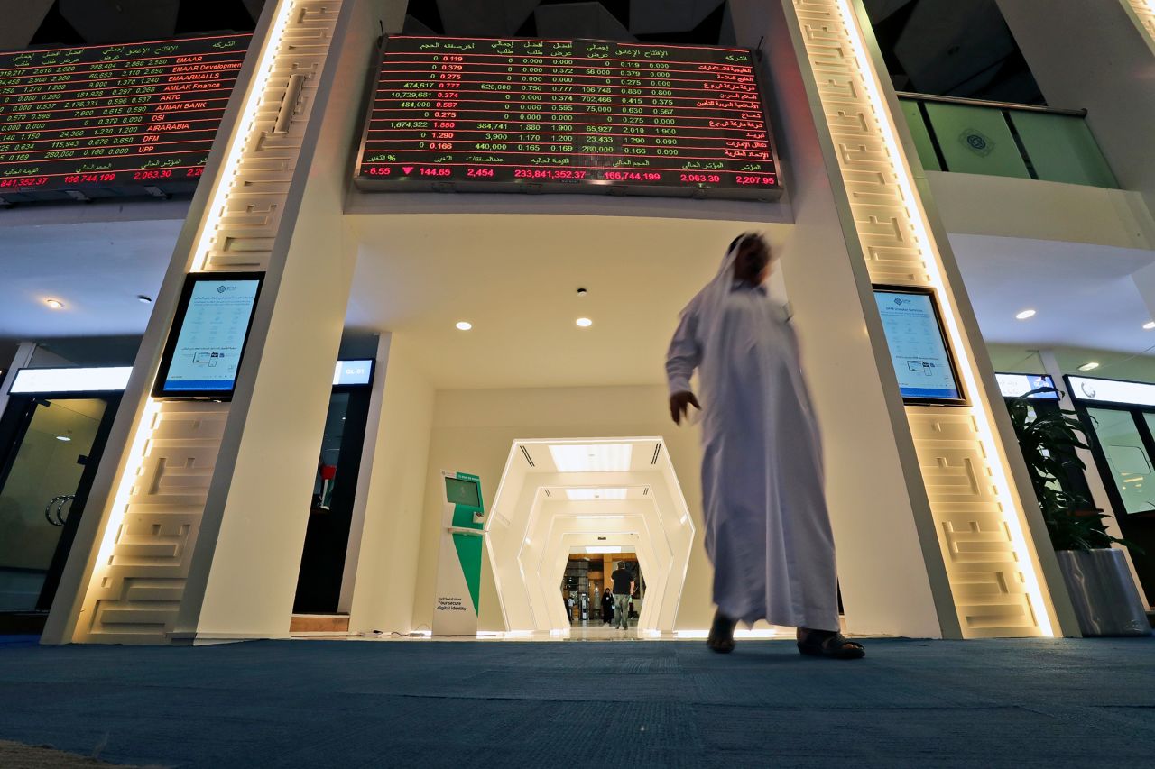 A trader arrives at the Dubai Financial Market in Dubai, United Arab Emirates, Thursday, March 12. 