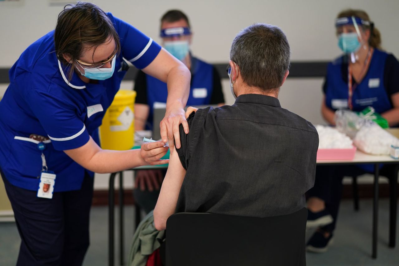 A Carlisle man receives the AstraZeneca/Oxford University Covid-19 vaccine at the Penrith Auction Mart Vaccination Centre on March 25 in Penrith, England.