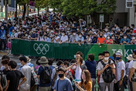 Spectators gather to watch the triathlon relay on Saturday, July 31, in Tokyo. 