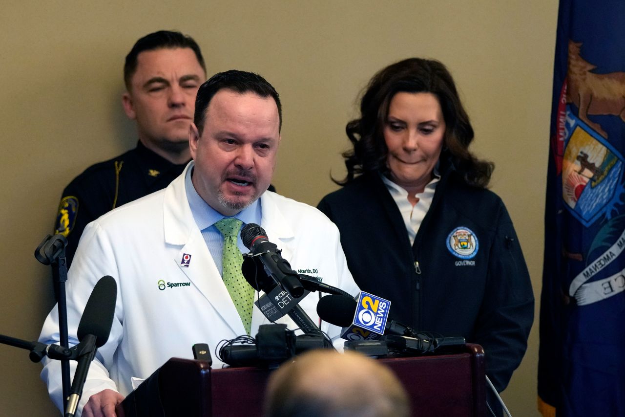 Dr. Denny Martin address the media in East Lansing, Michigan, on Tuesday.